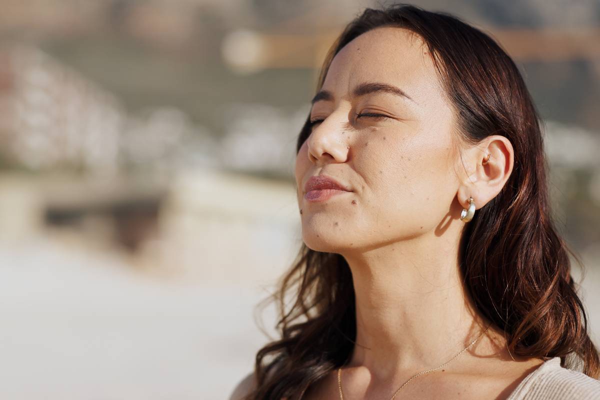 Calm, fresh air and woman outdoor for wellness, zen and breathing in nature of California and trave