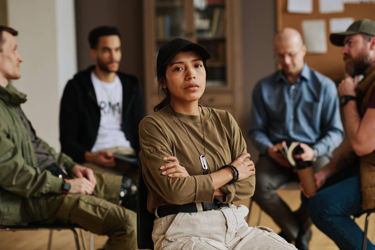 Young stressed Hispanic woman with her arms crossed on chest looking at you