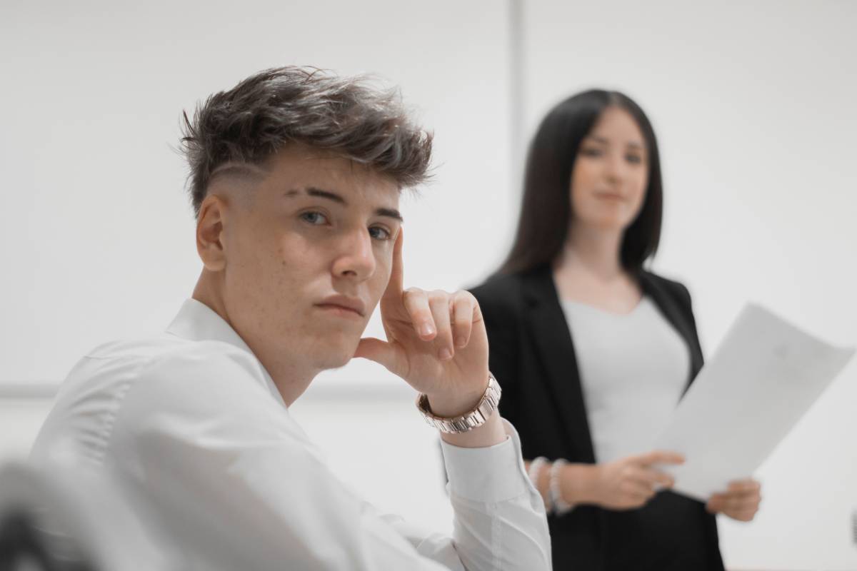 Caucasian man and woman reading and discussing their studies